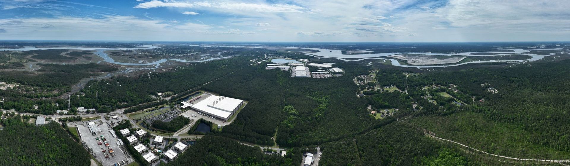 An aerial view of a city surrounded by trees and buildings.