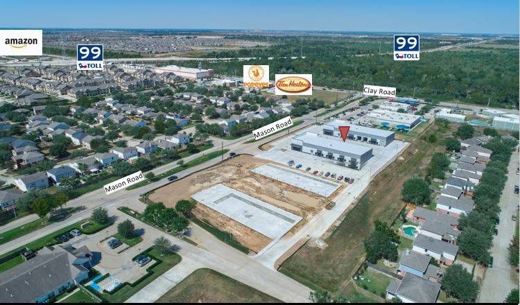 An aerial view of a residential area with a lot of buildings and trees