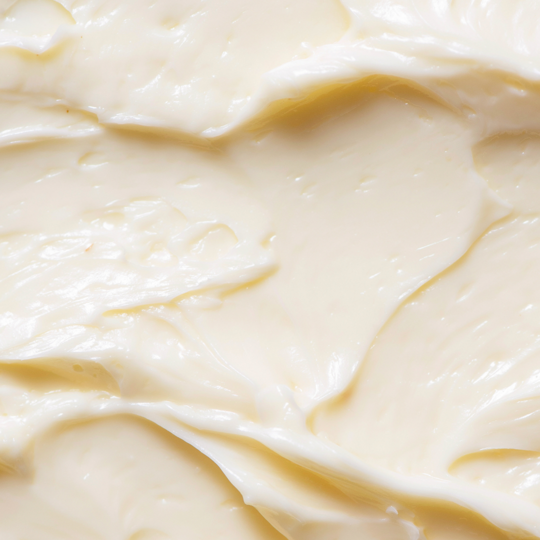 Image of creamy body butter in a light cream color