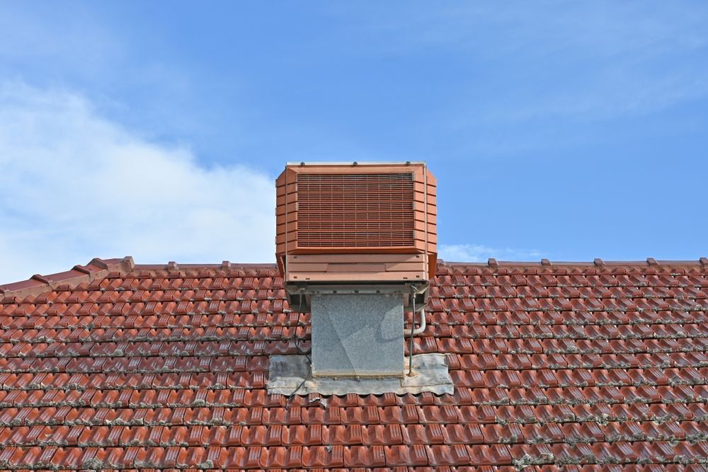 Brown Rooftop With a Rectangular Ventilation Unit Against a Blue Sky — Priest Airconditioning in Temora, NSW