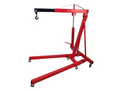 A red engine crane with wheels on a white background.