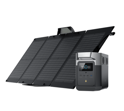 Black solar panel array and portable power station on a white background.
