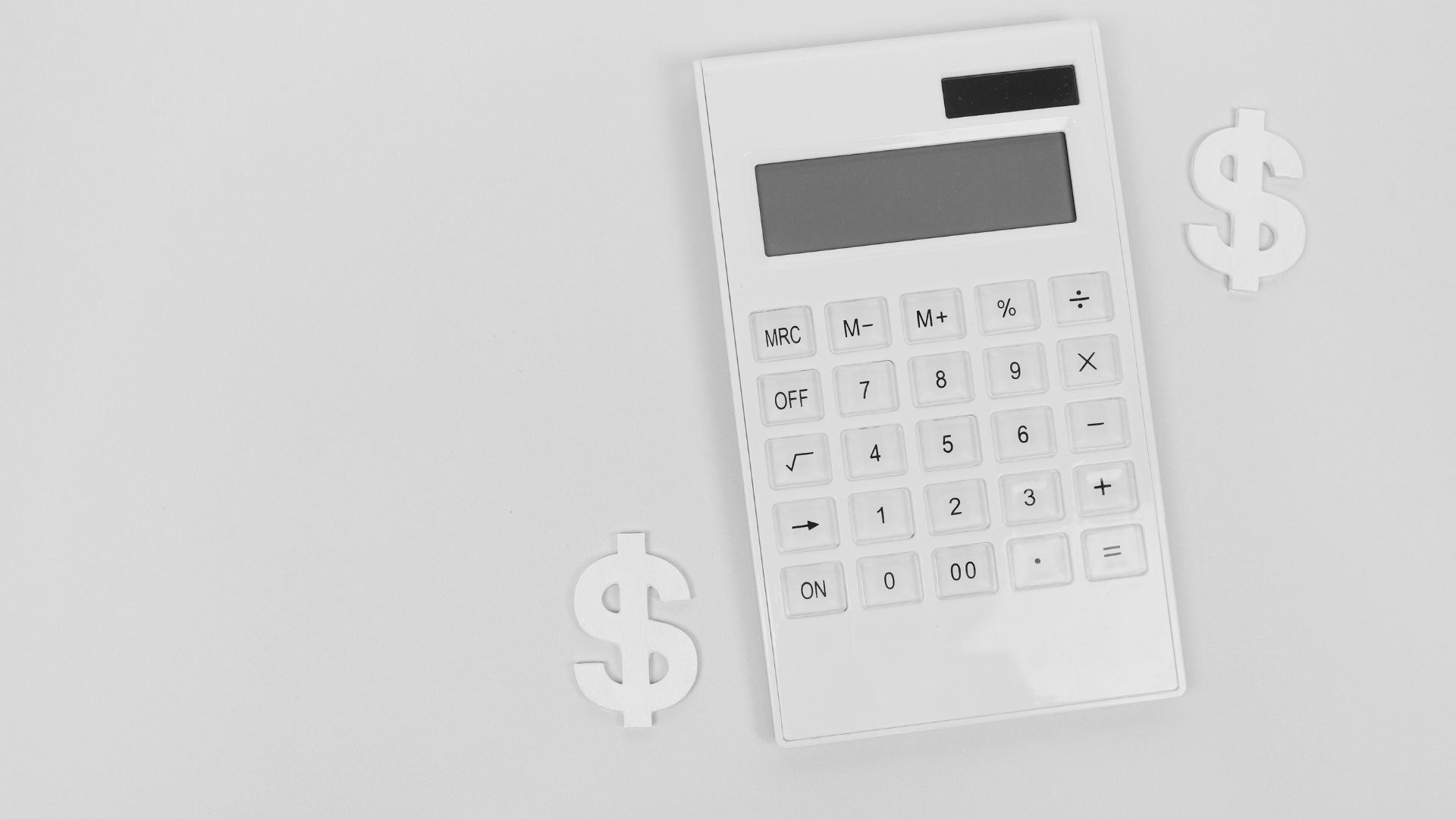 White calculator with two dollar signs on a white background.