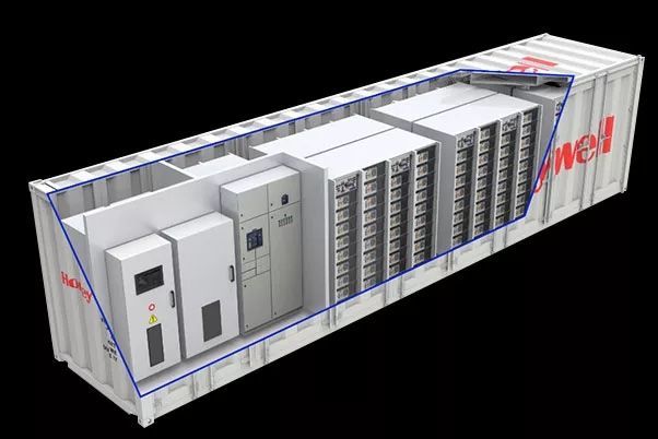 White shipping containers lined up outdoors under a clear blue sky.