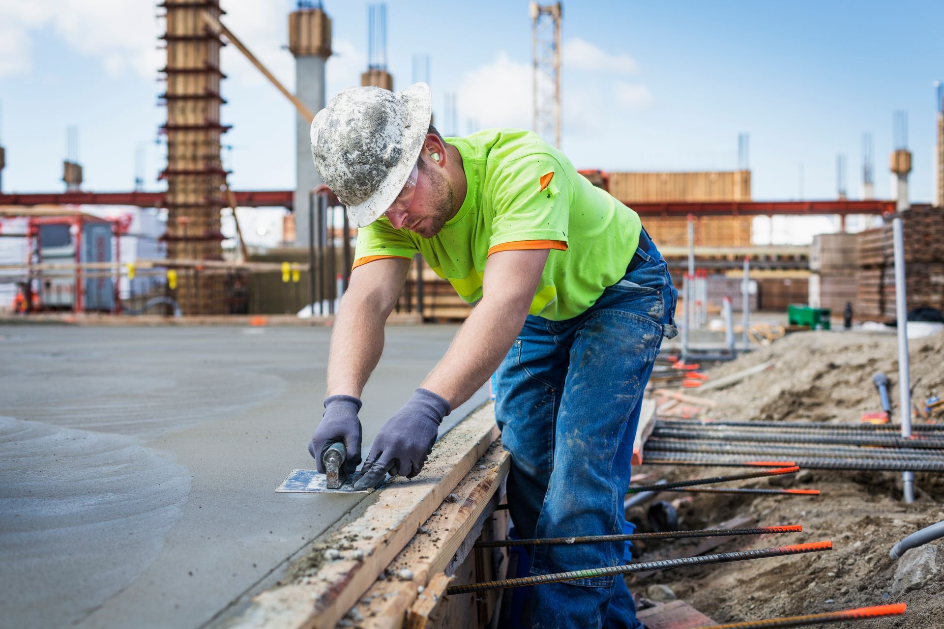A Construction Worker Is Working On A Concrete Slab At A Construction Site — Riverton, UT — Great Basin Staffing LLC