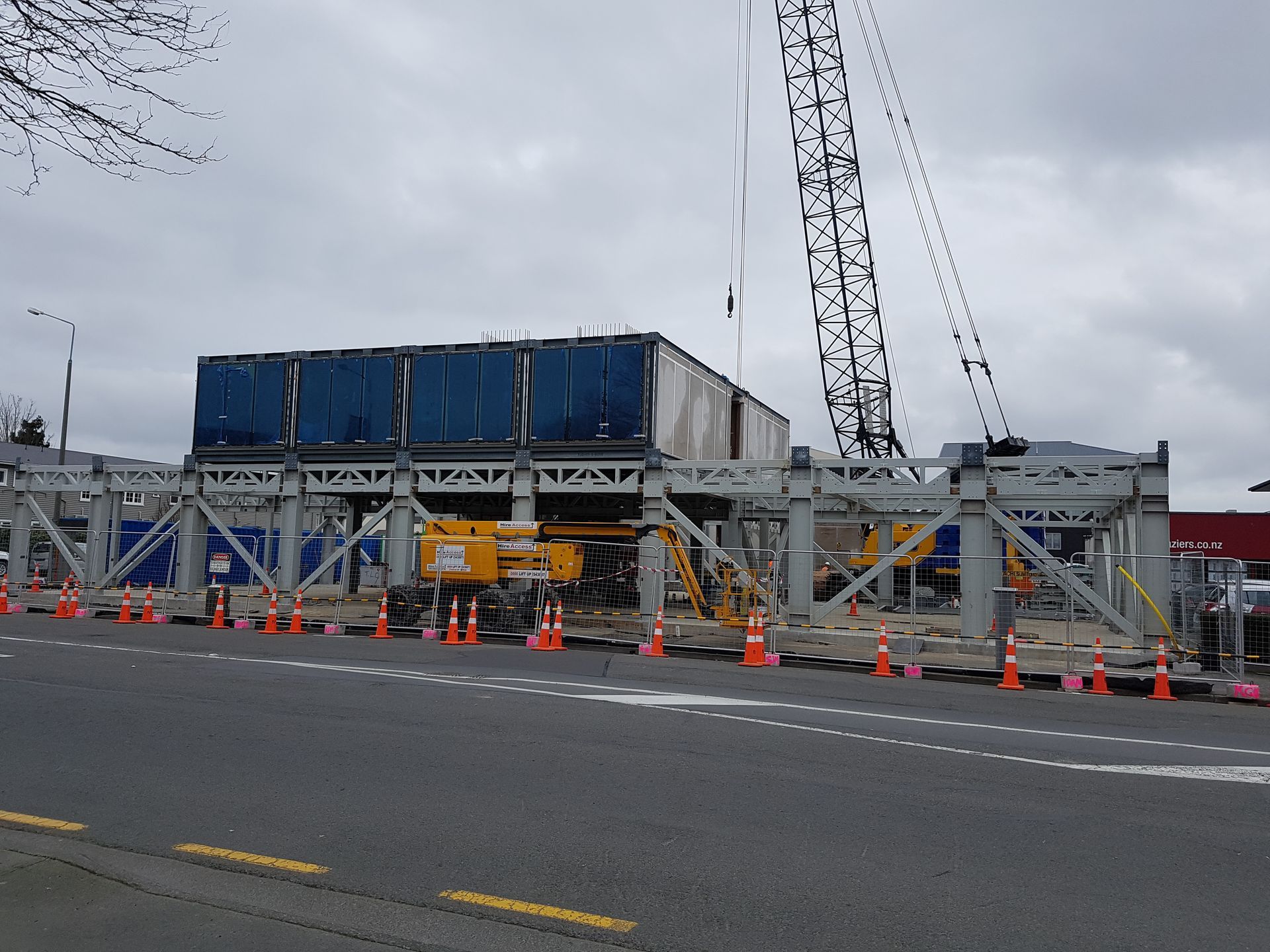 A construction site with a crane in the background