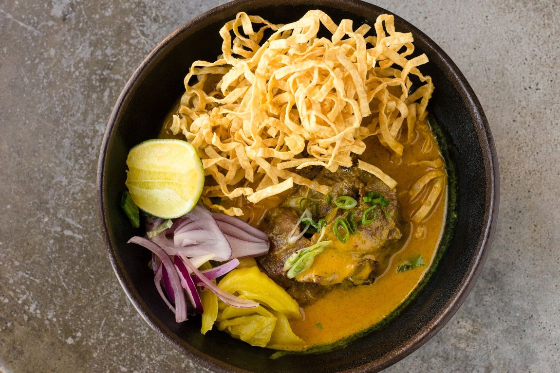 Picture of noodles with Kao Soi Curry broth served with grilled steak