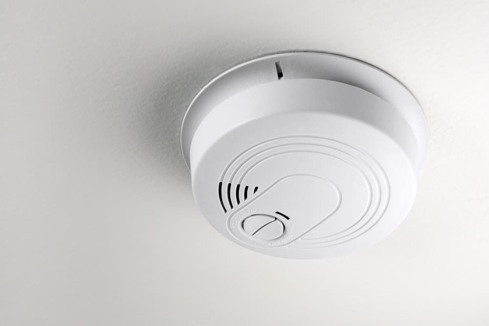 A white smoke detector is mounted to the ceiling. — D.J. Whatley & Son Pty Ltd in Ormeau Hills, QLD