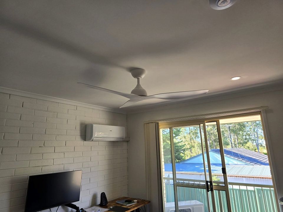 A Bedroom With a Ceiling Fan and a Sliding Glass Door — D.J. Whatley & Son Pty Ltd in Coomera, QLD