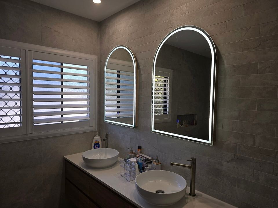 A Bathroom With Two Sinks and Two Mirrors — D.J. Whatley & Son Pty Ltd in Ormeau Hills, QLD