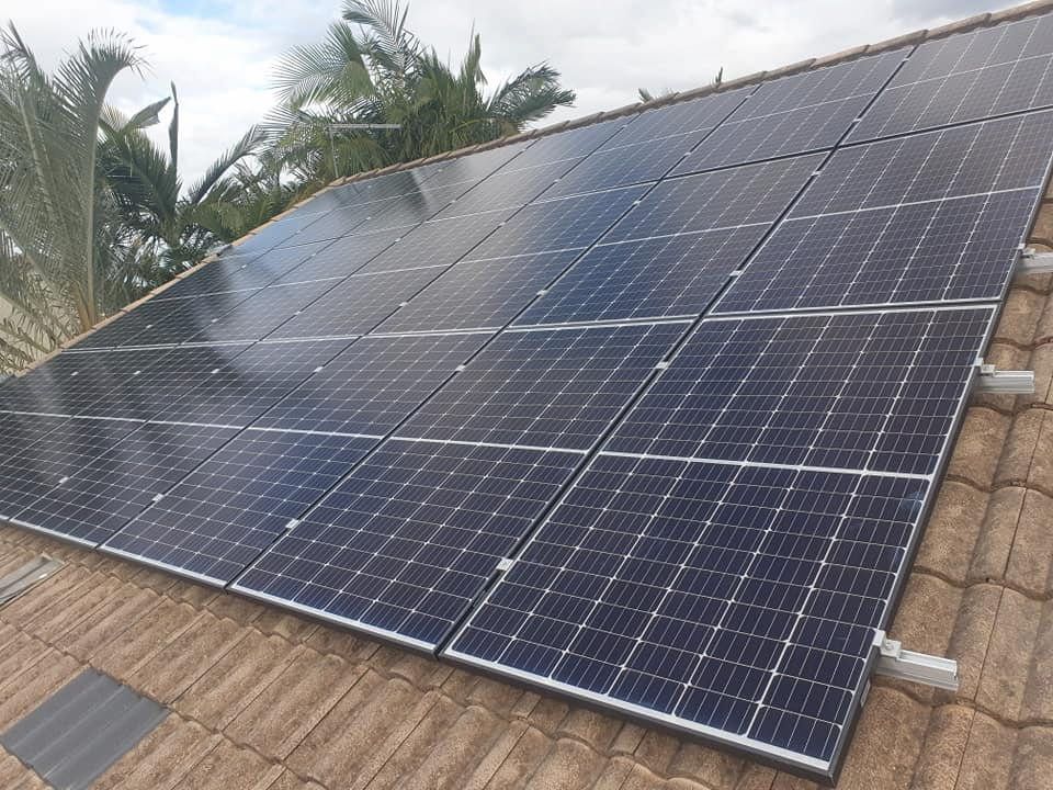 A Roof With a Lot of Solar Panels on It — D.J. Whatley & Son Pty Ltd in Ormeau Hills, QLD