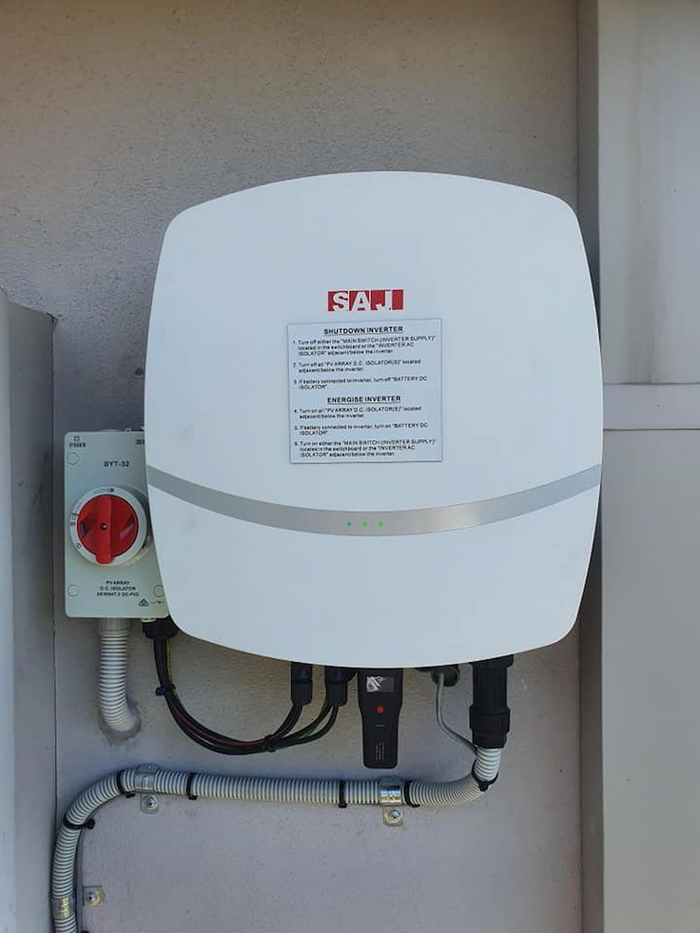 A White Solar Panel Sitting on Top of a White Wall — D.J. Whatley & Son Pty Ltd in Beenleigh, QLD