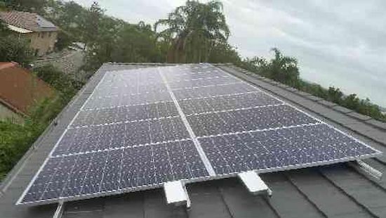 A Roof With a Lot of Solar Panels on It — D.J. Whatley & Son Pty Ltd in Ormeau Hills, QLD