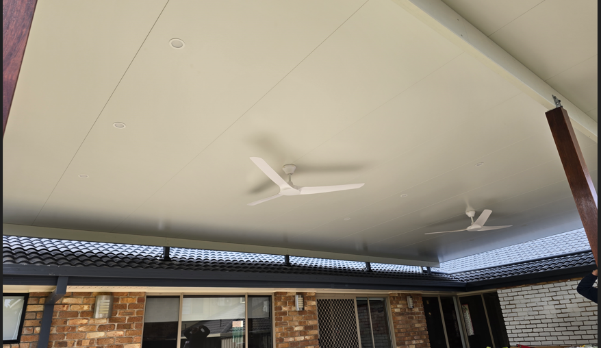 A Man is Walking Down a Dirt Path Between Two Buildings — D.J. Whatley & Son Pty Ltd in Ormeau Hills, QLD