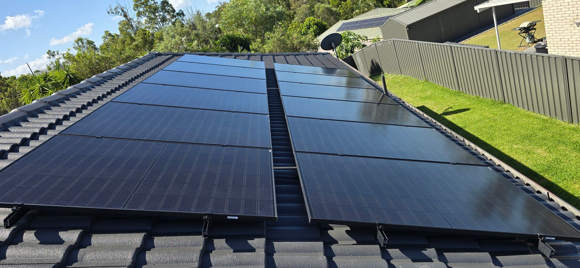 A Roof With a Lot of Solar Panels on It — D.J. Whatley & Son Pty Ltd in Ormeau Hills, QLD