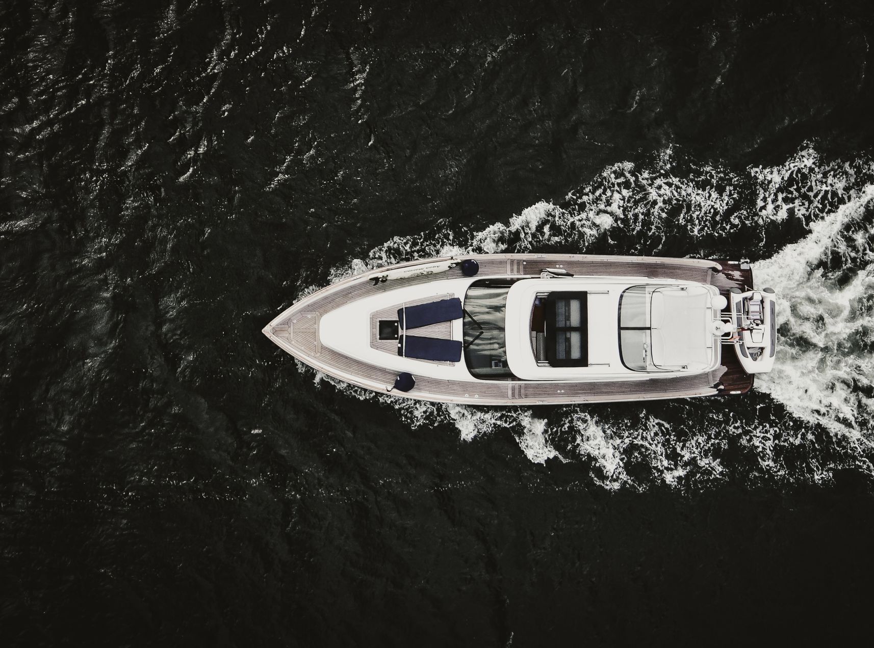 A White Boat on a Lake Shot From Overhead. Call Duckworth Injury Law for a Pic Case in Lake Ozark.