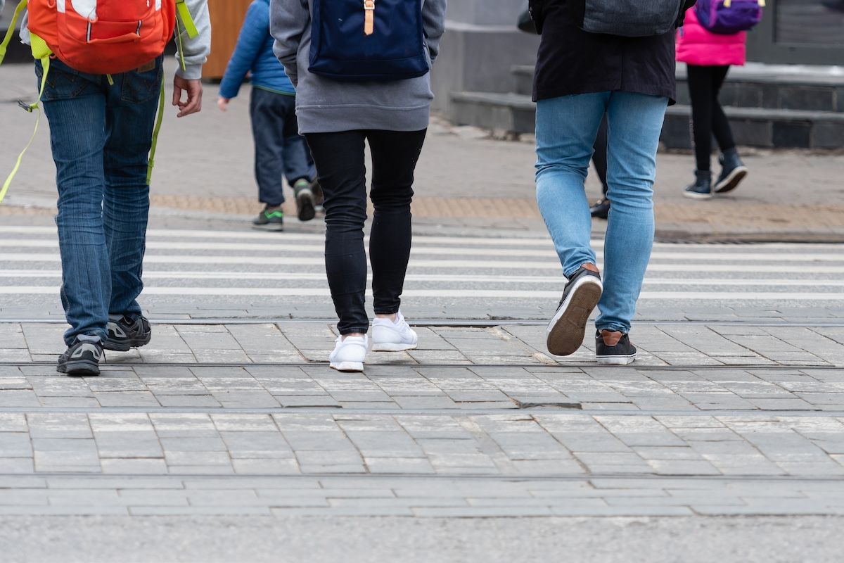 College Students Walking on a Crosswalk in Columbia, MO. Duckworth Injury Law Works for Students.