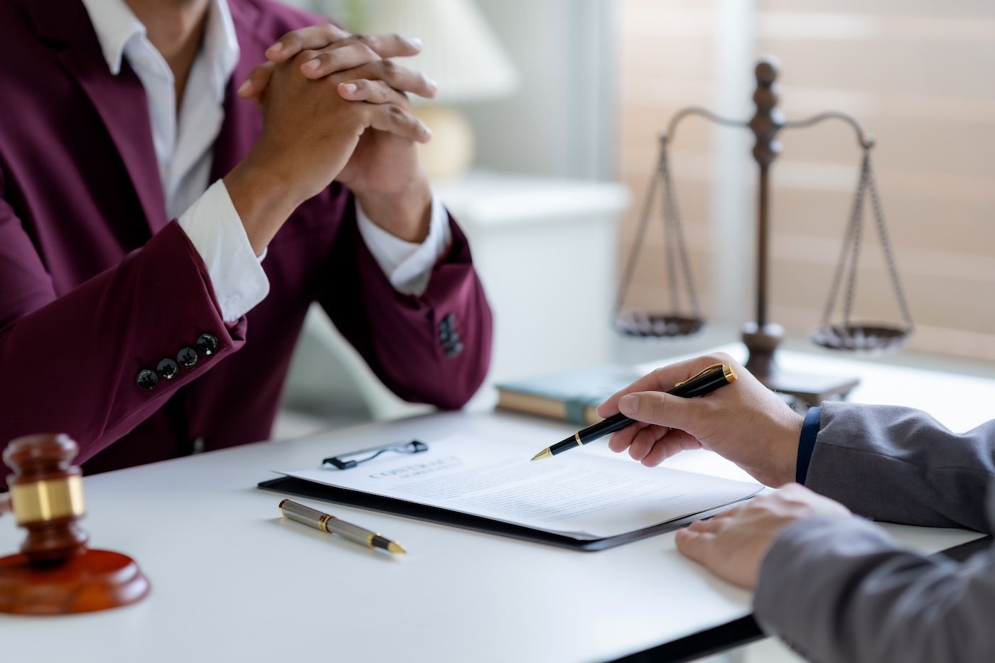 A personal injury attorney meets with a client to discuss the process of taking a case to trial.