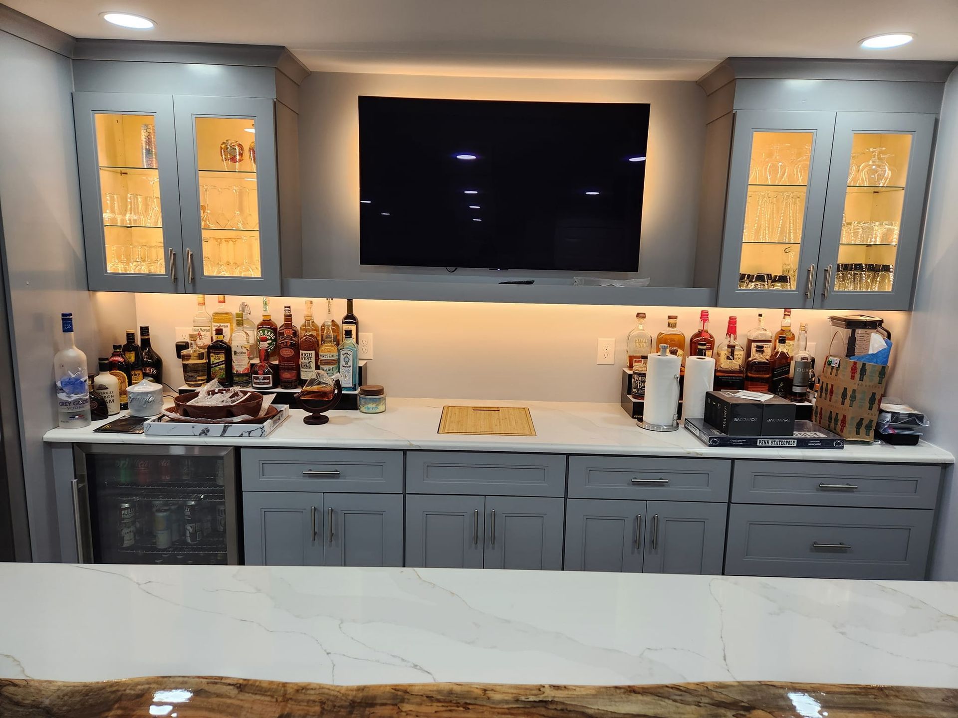 a kitchen with a granite counter top and a stainless steel sink