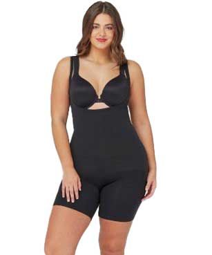 A plus size woman is wearing a black bodysuit and bra.
