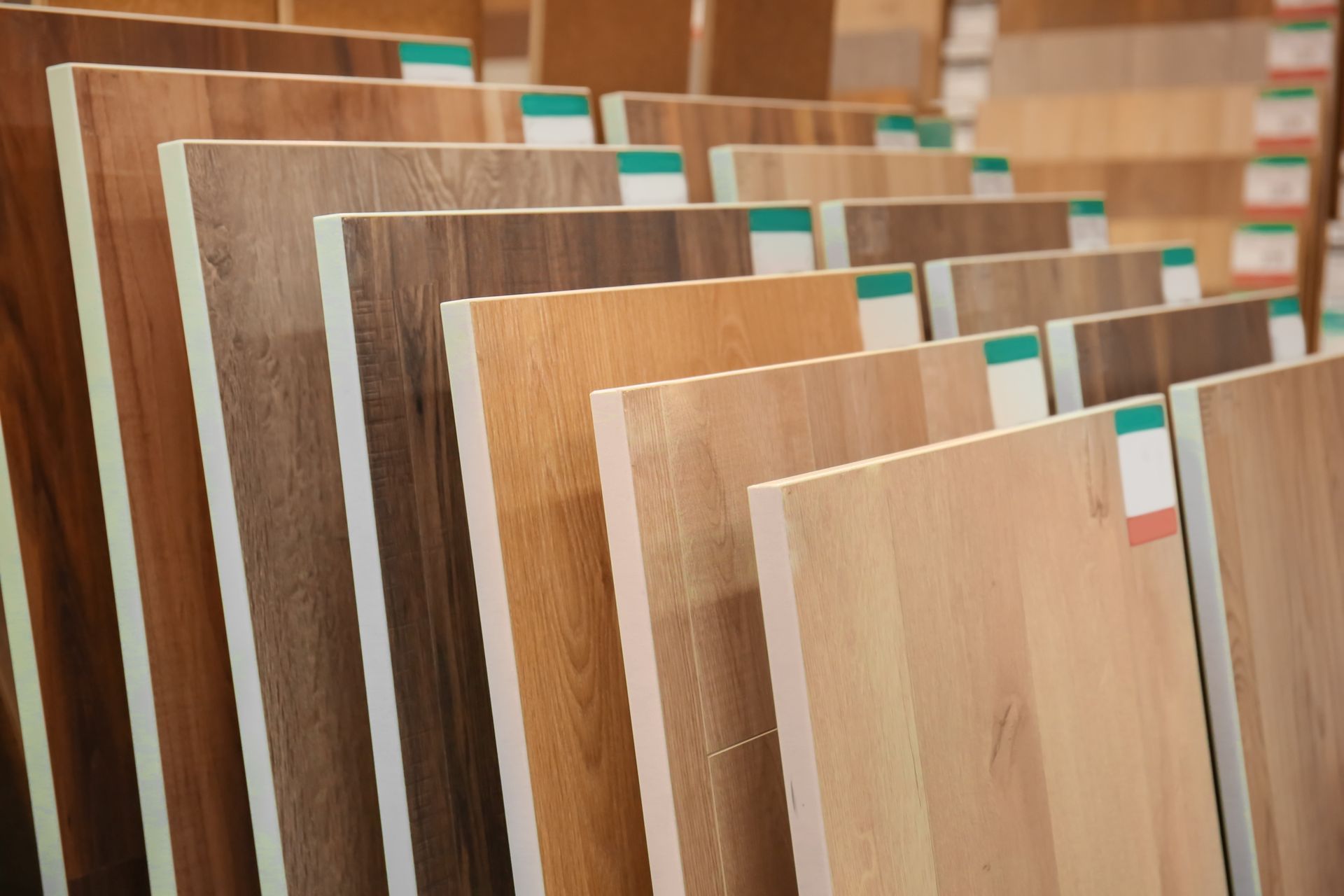 Samples of various wood flooring types in a showroom.