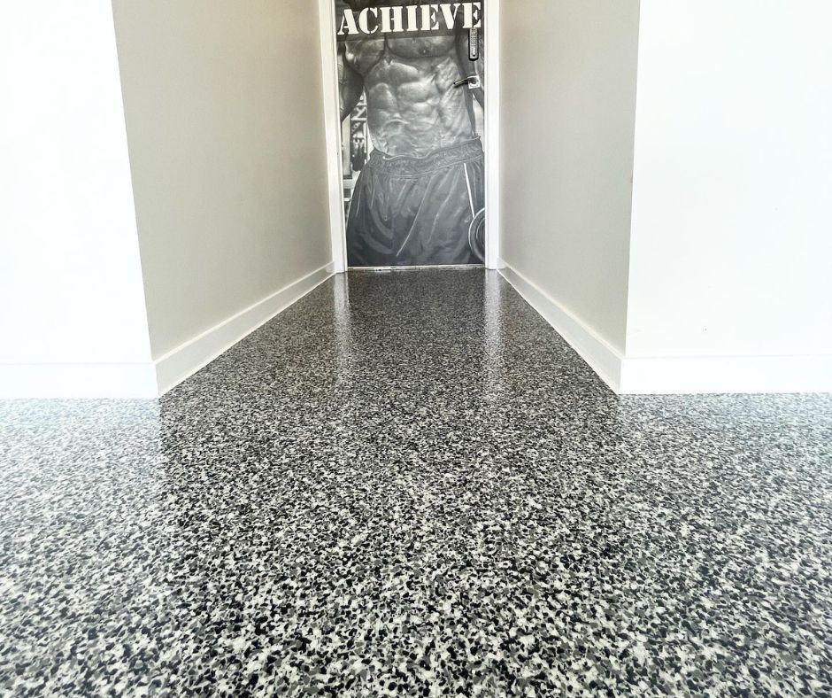 Professional epoxy floor installation in a residential garage