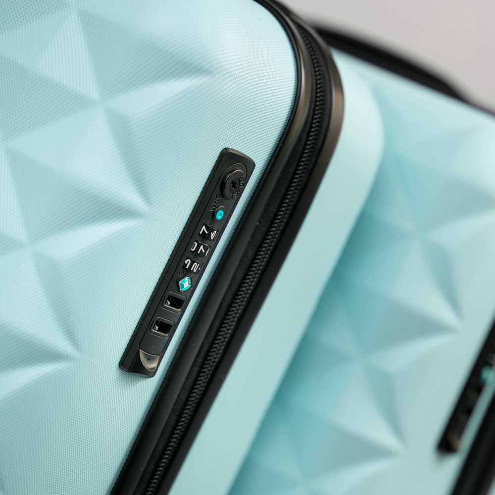 A close up of a blue suitcase with a black zipper