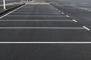 Empty parking lot outdoor with white marking lines