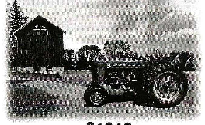 a black and white photo of a tractor parked in front of a barn .