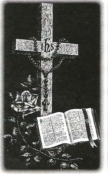 a black and white drawing of a cross and a bible .