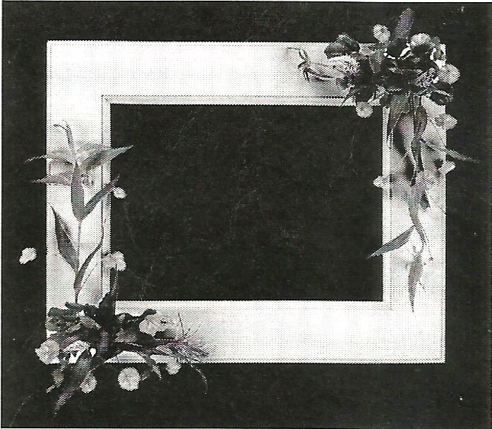 a black and white photo frame with flowers on it