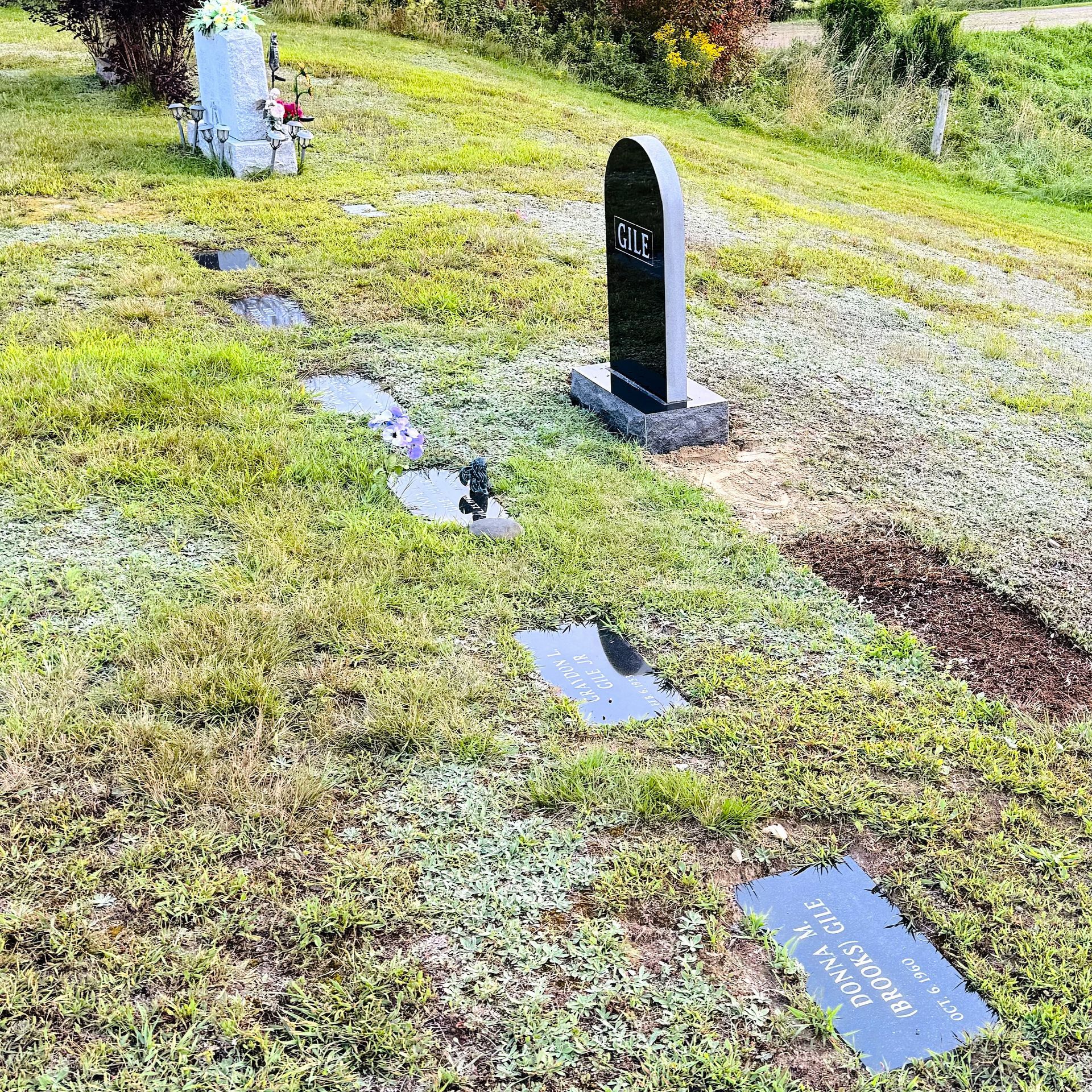 Tombstone markers installed by Champlain Monuments