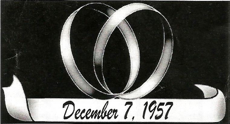 a picture of two wedding rings and the date december 7 1957