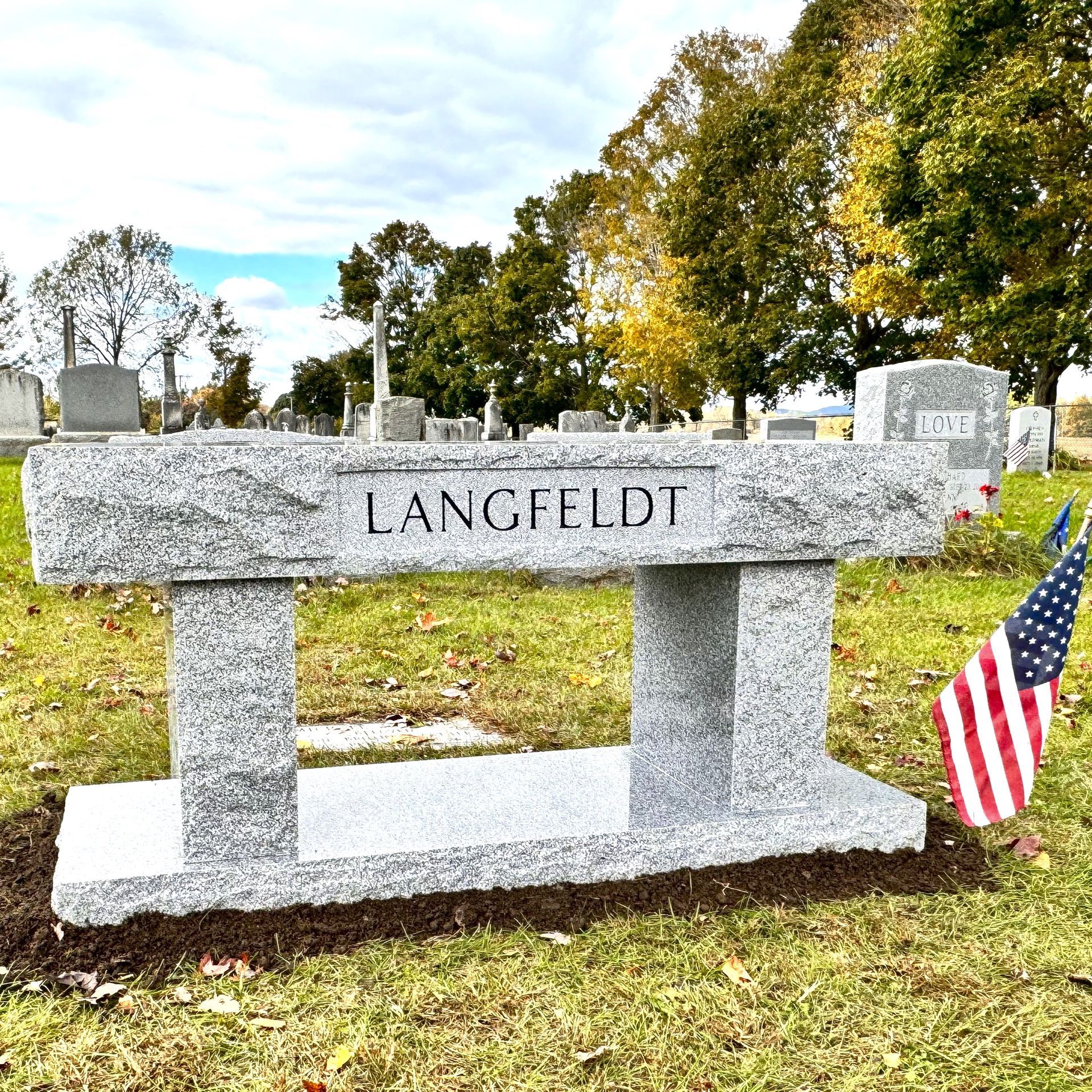 Custom granite bench installed by Champlain Monuments.
