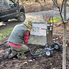 Sandblast lettering on a boulder. 