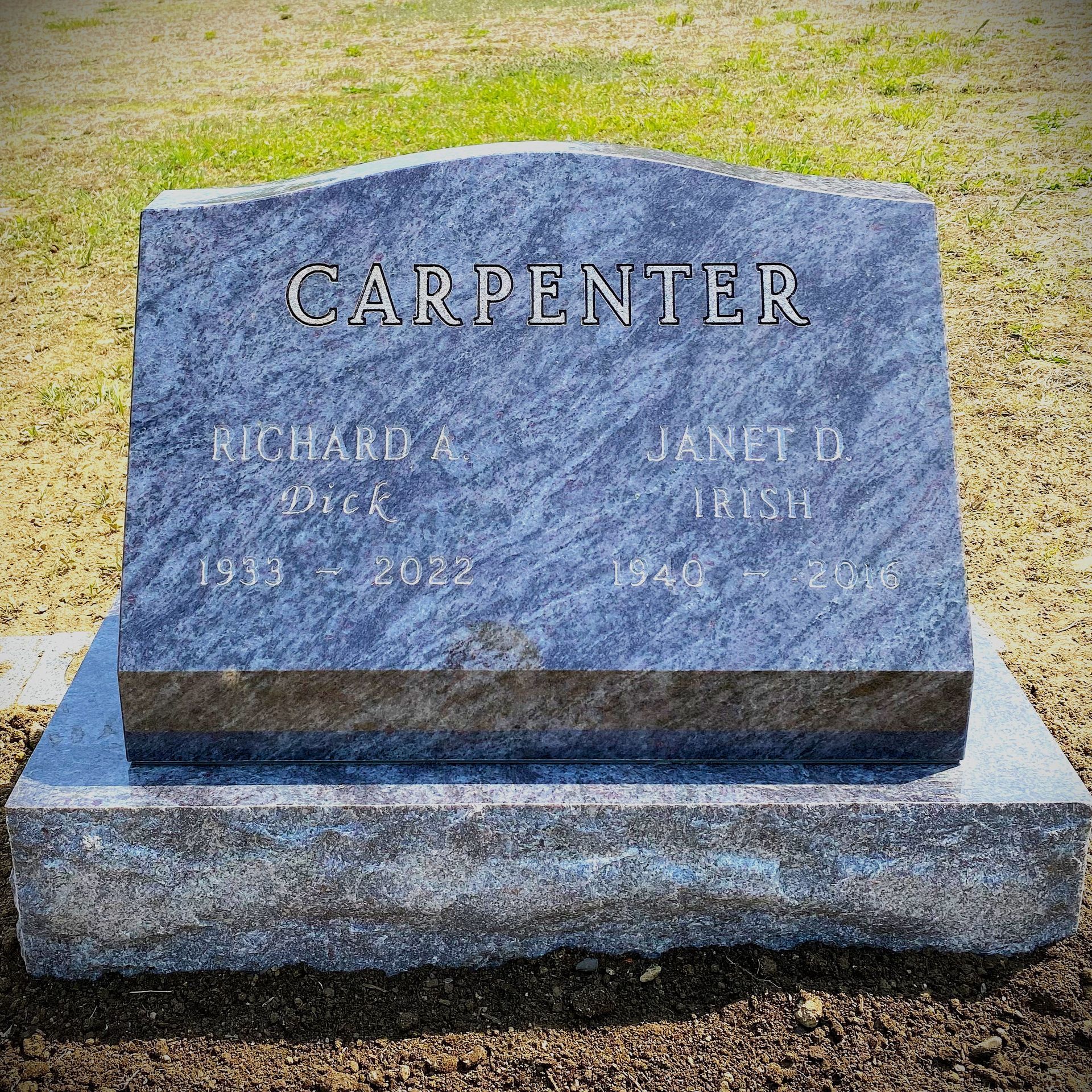 Bahama Blue granite slant monument installed by Champlain Monuments