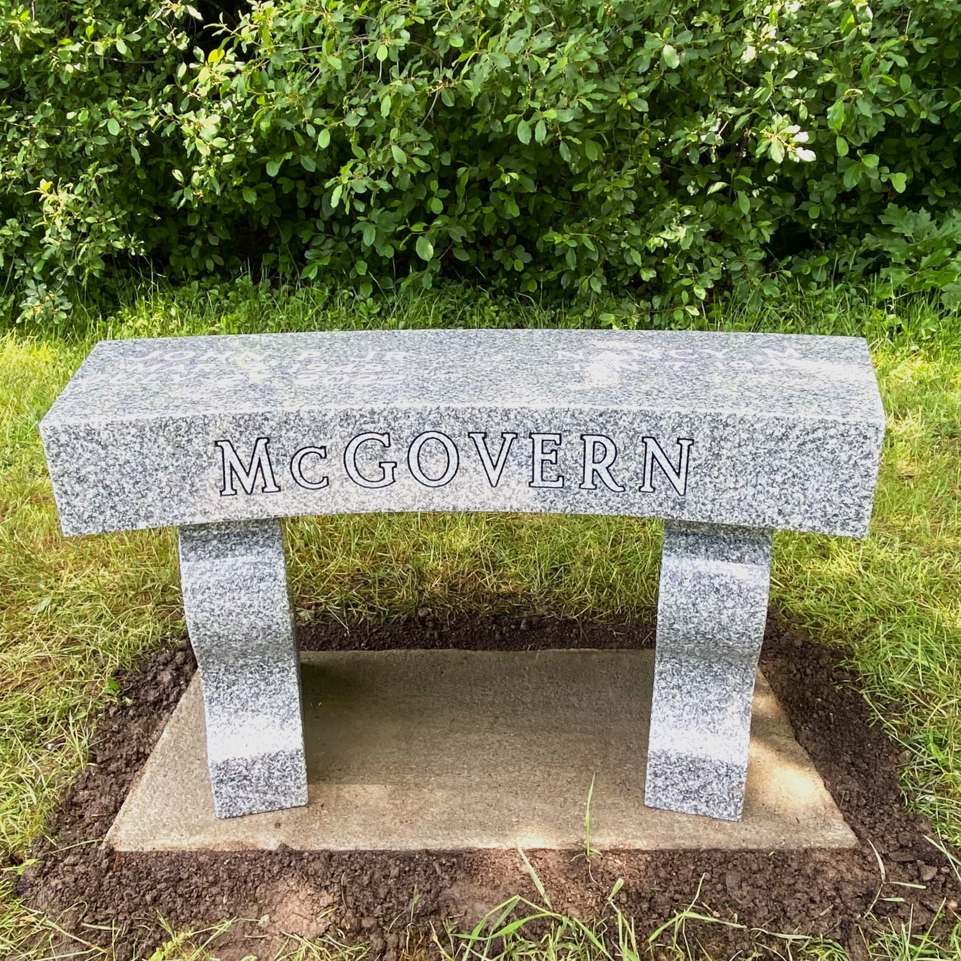Custom granite bench installed by Champlain Monuments.