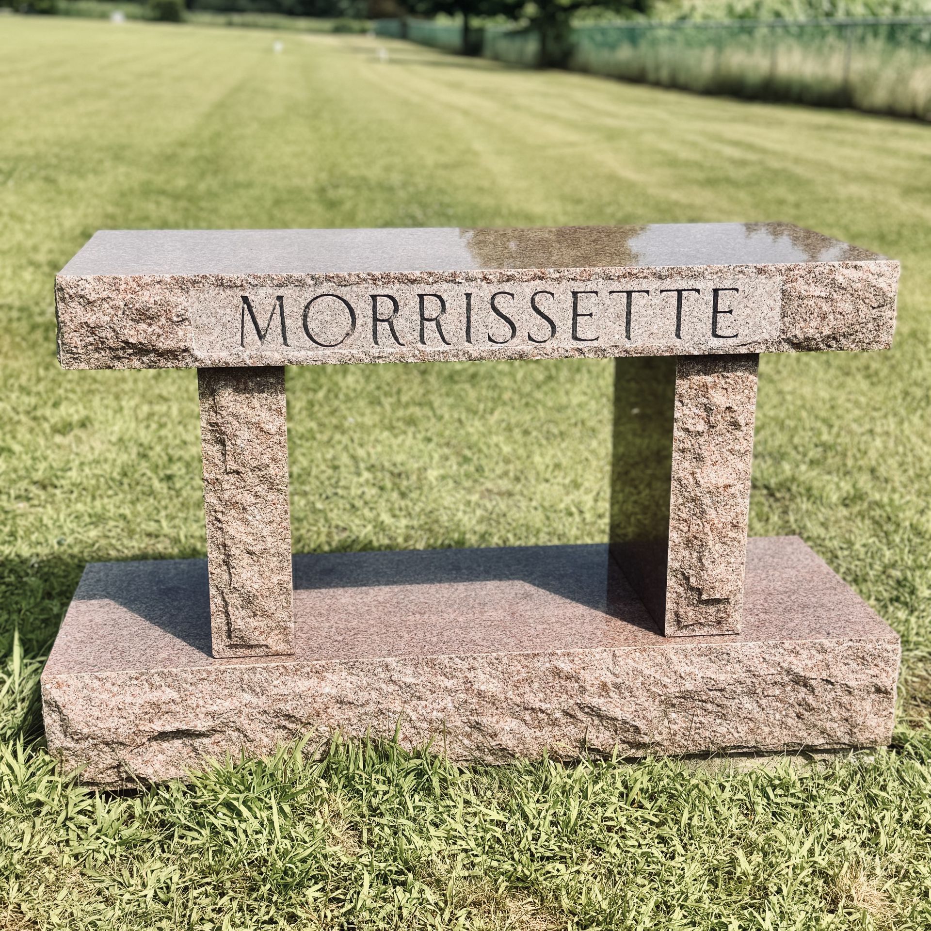 Custom granite bench installed by Champlain Monuments.