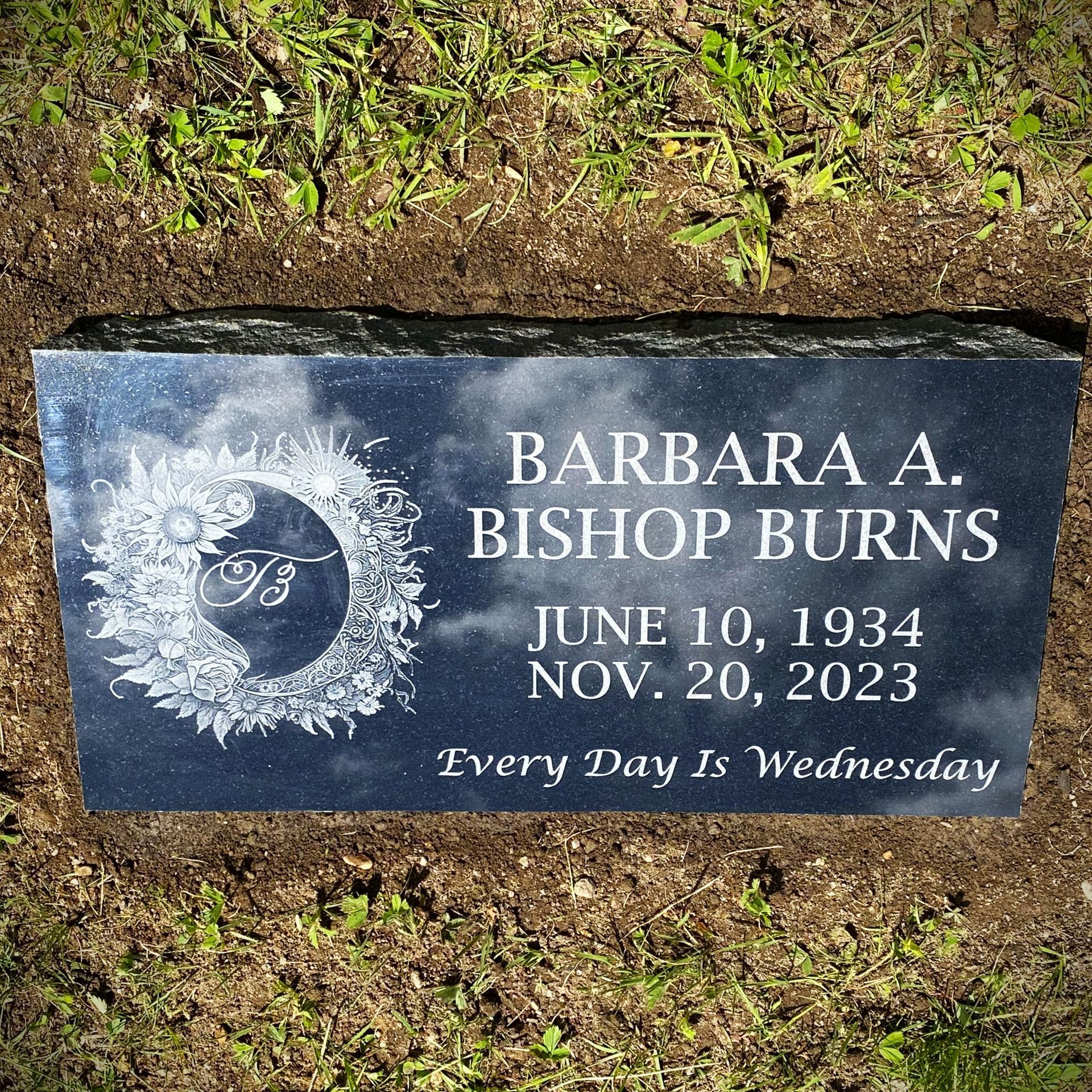 Black marker with etching installed by Champlain Monuments