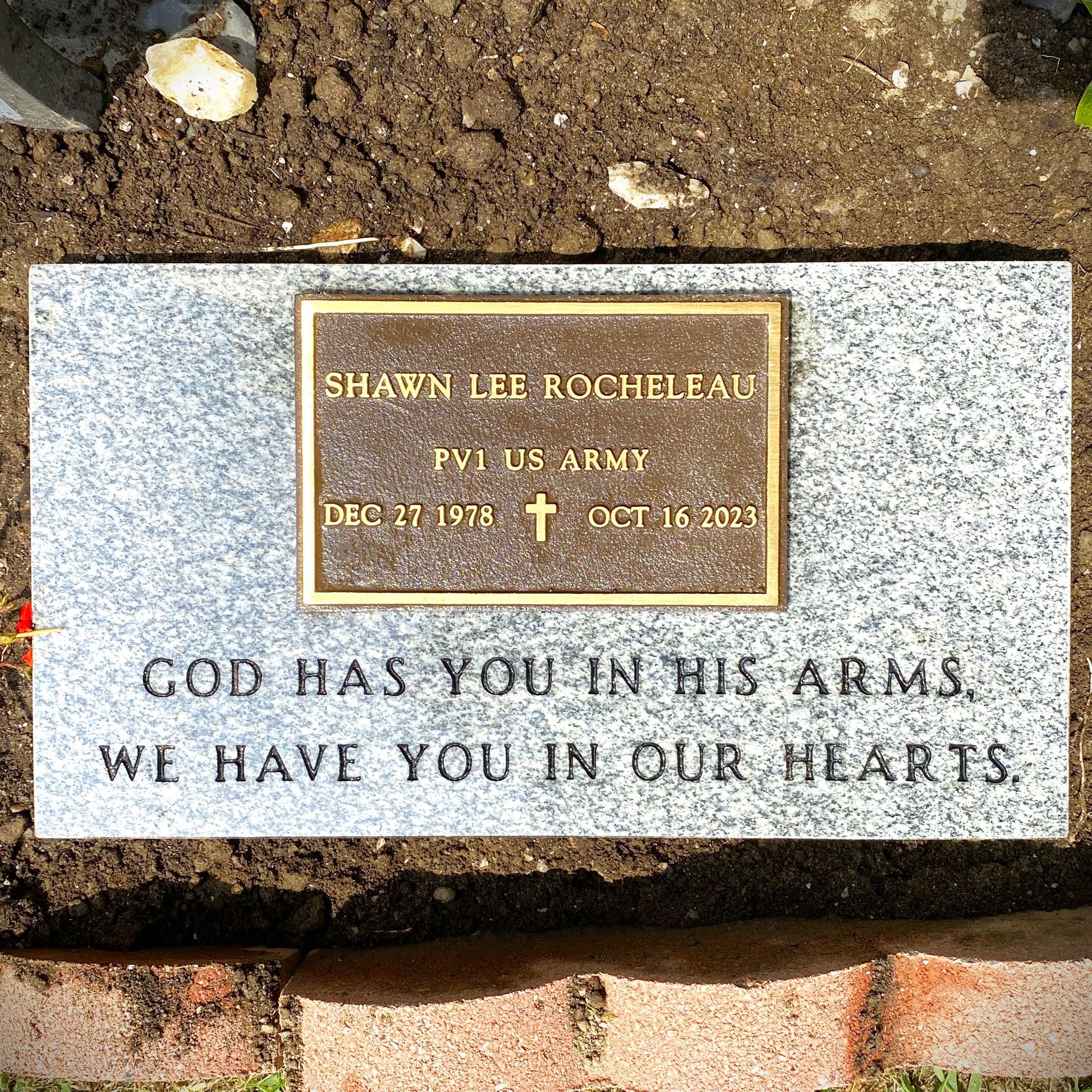 Granite marker with a plaque installed by Champlain Monuments