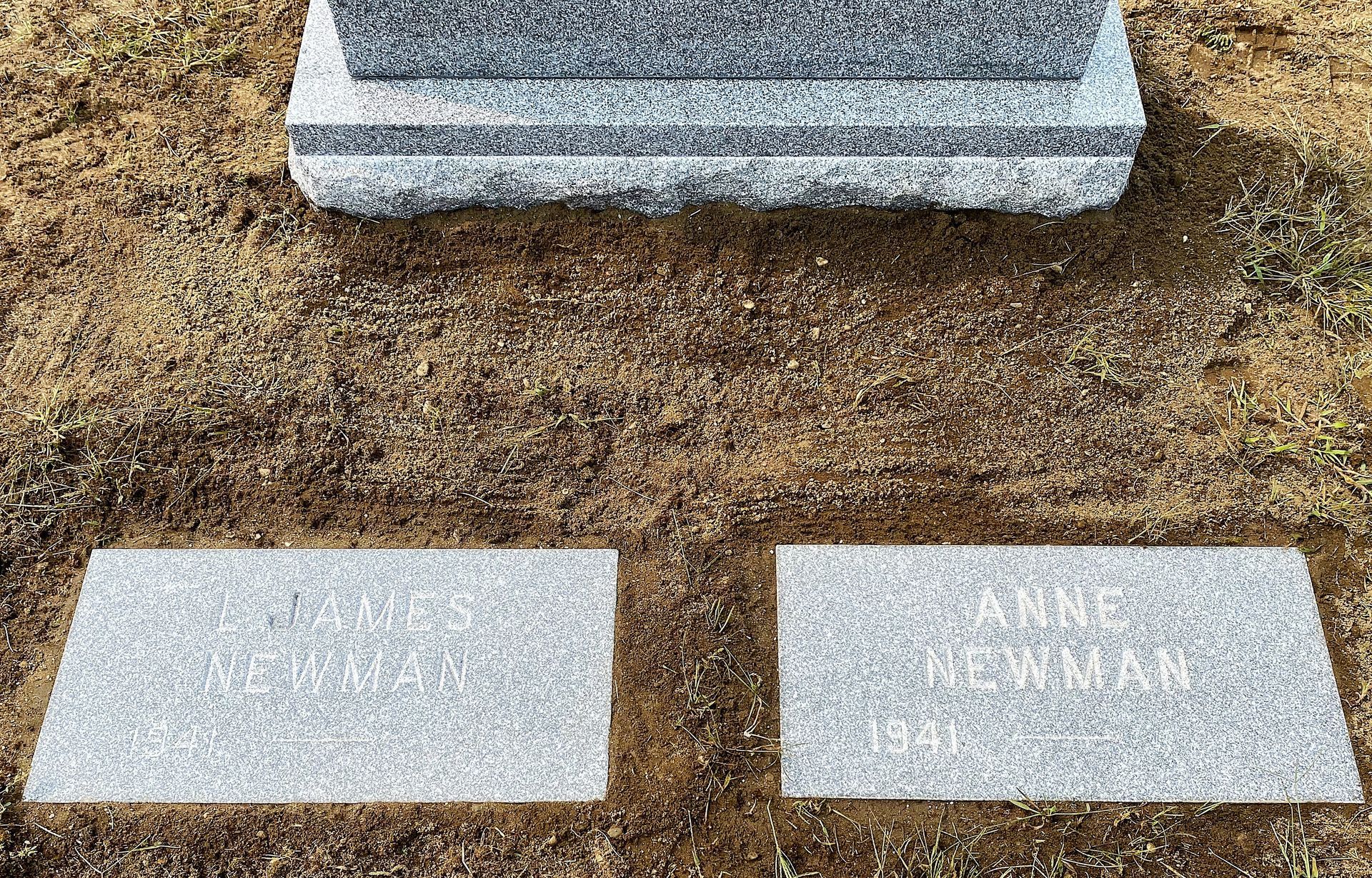 Matching footstones installed by Champlain Monuments