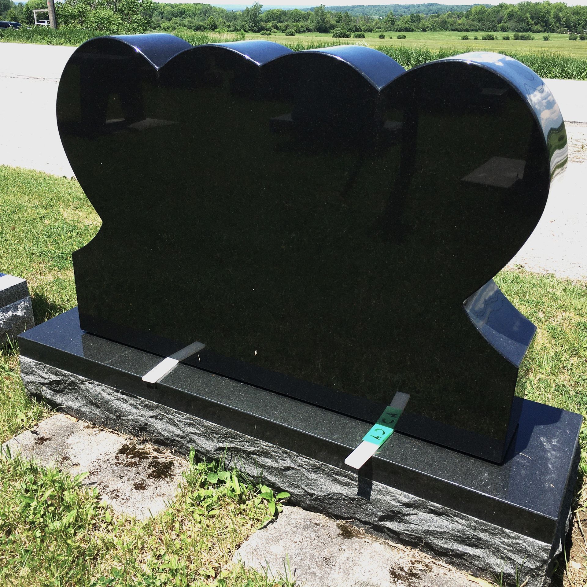Black granite etching double heart memorial by Champlain Monuments