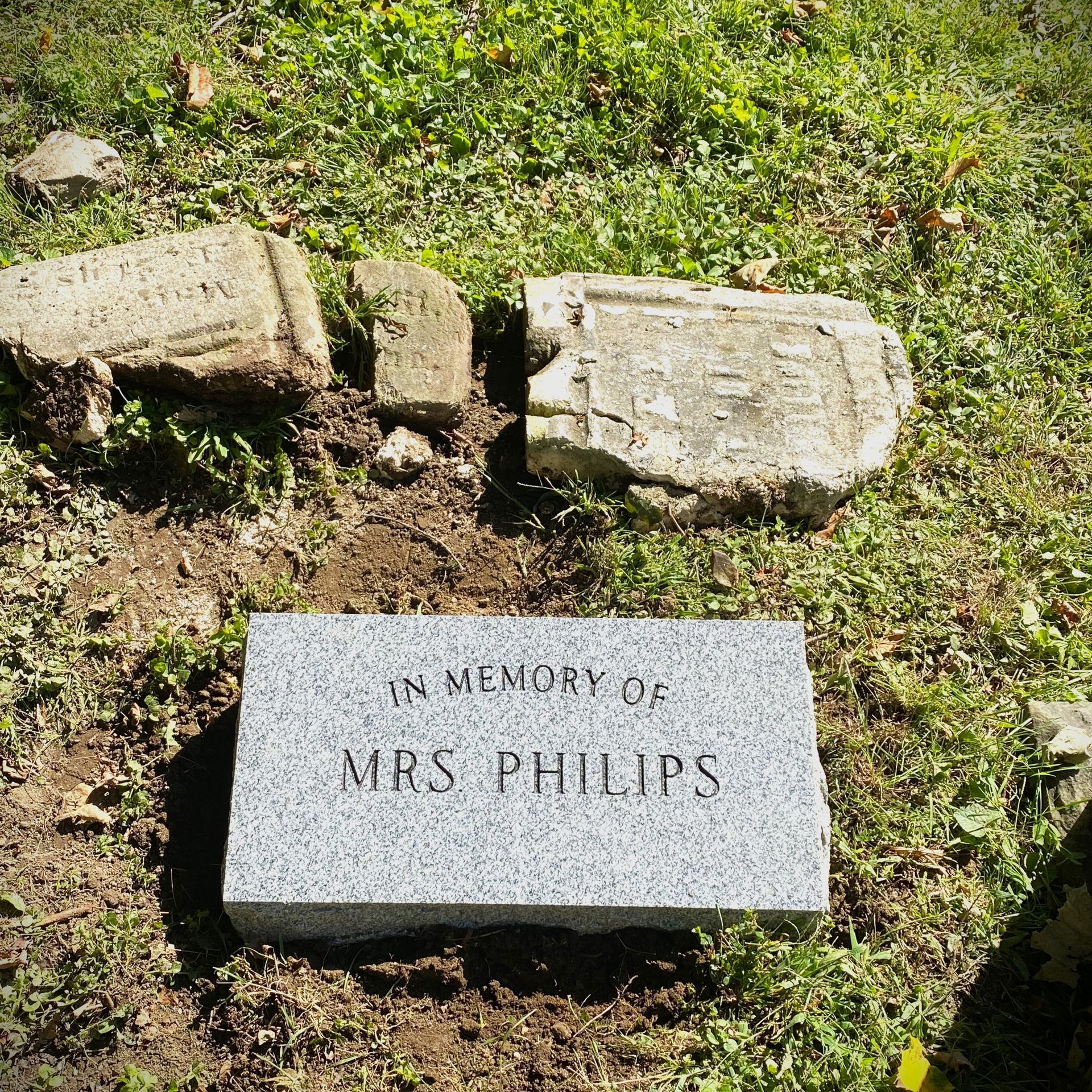 Small granite marker used as a replacement for a broken monument.