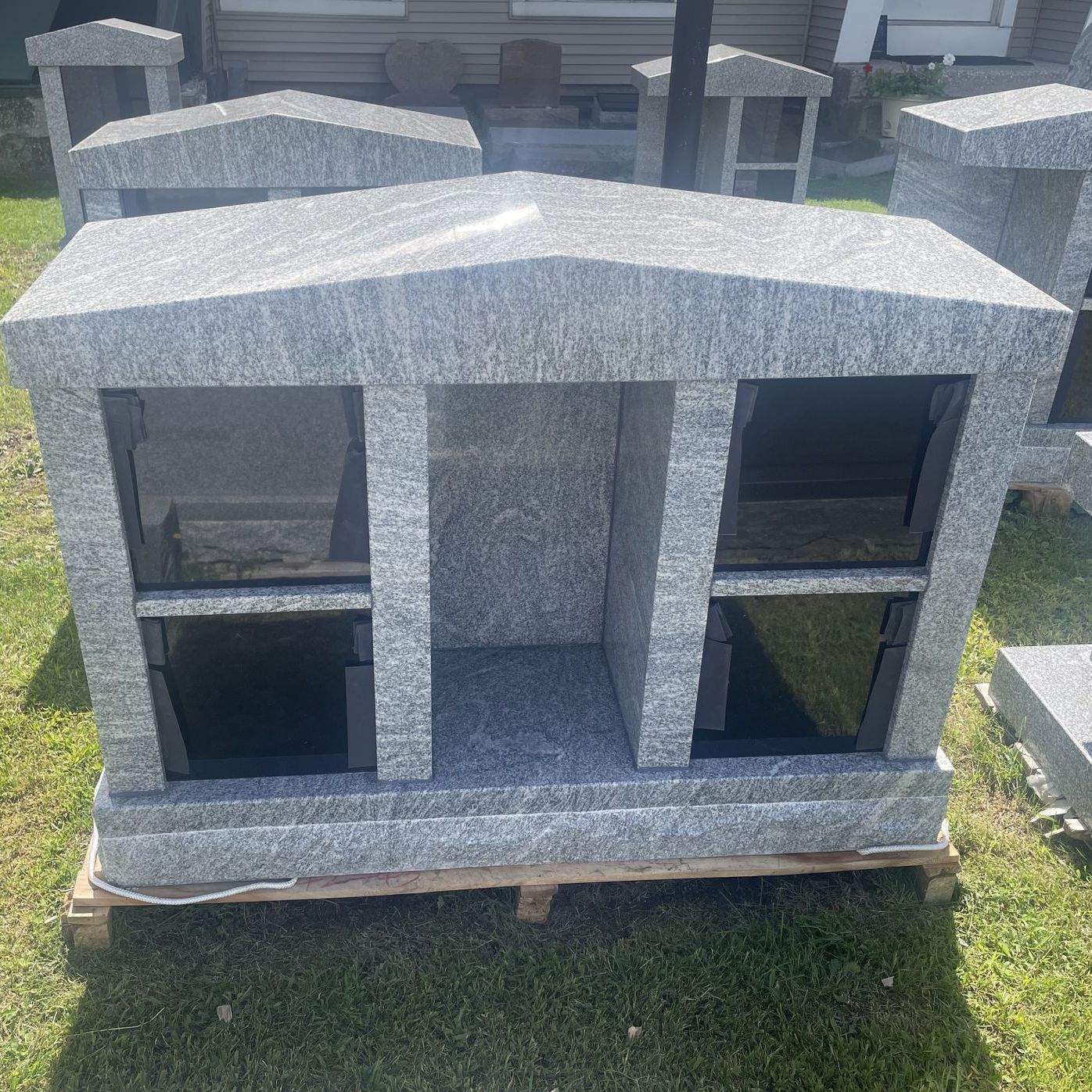 a large cremation monument in the champlain monuments display