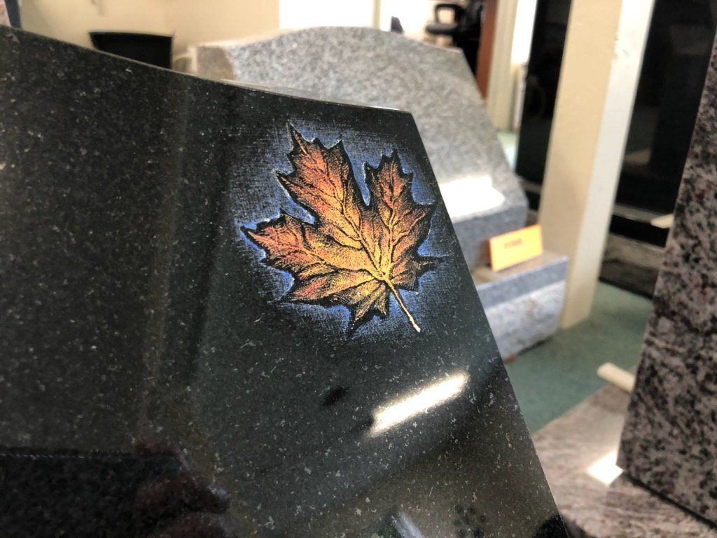 hand etched design on black granite
