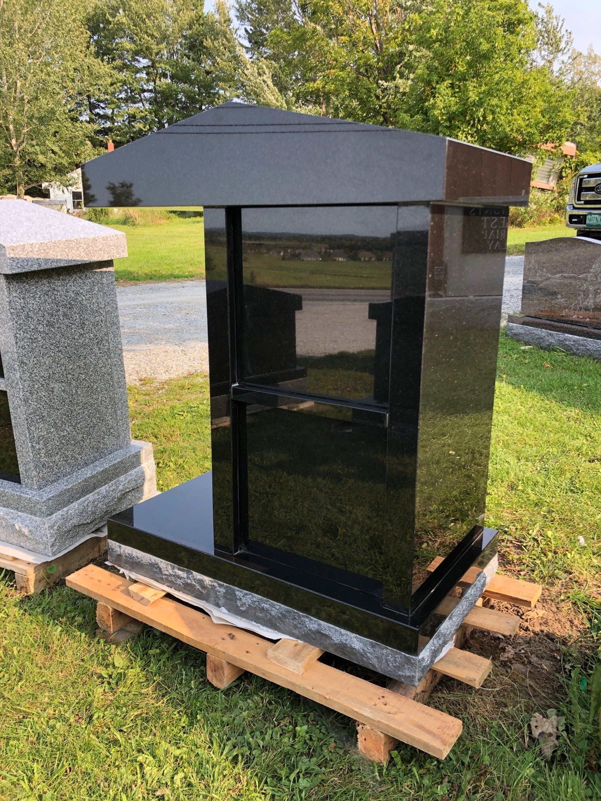Black granite cremation monument at Champlain Monuments.