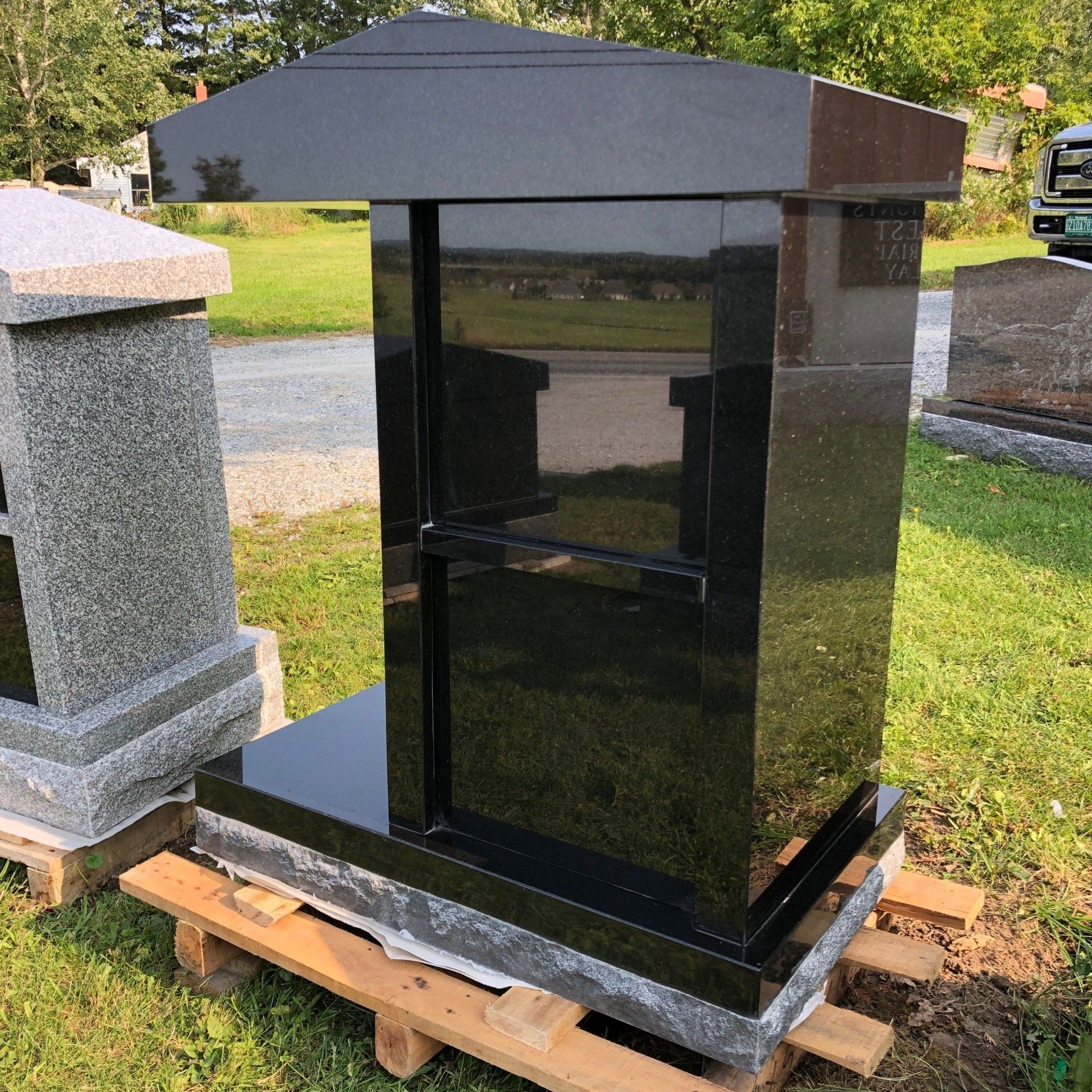 a black two person cremation monument in Saint Albans Vermont