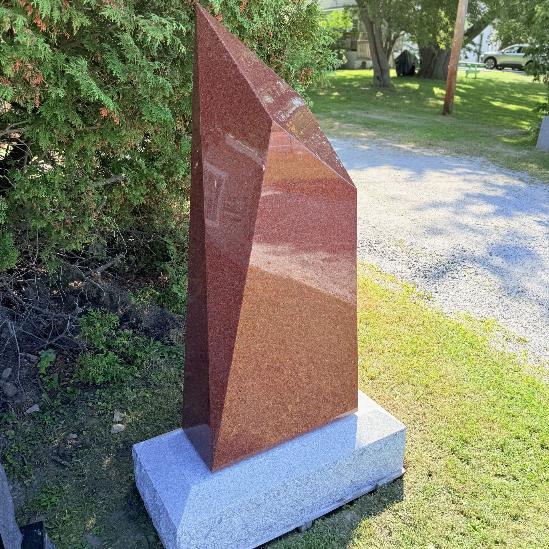 Red obelisk monument at Champlain Monuments.