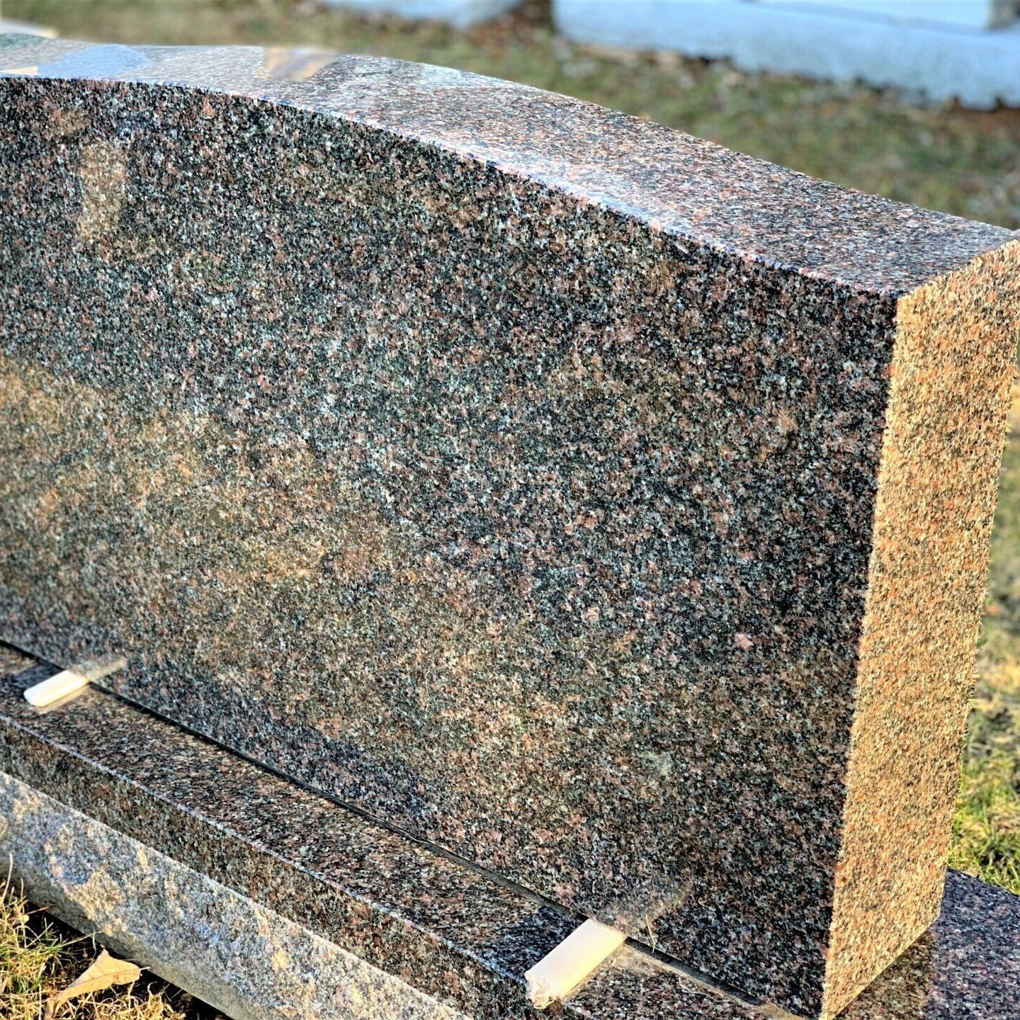 Mahogany granite headstone.