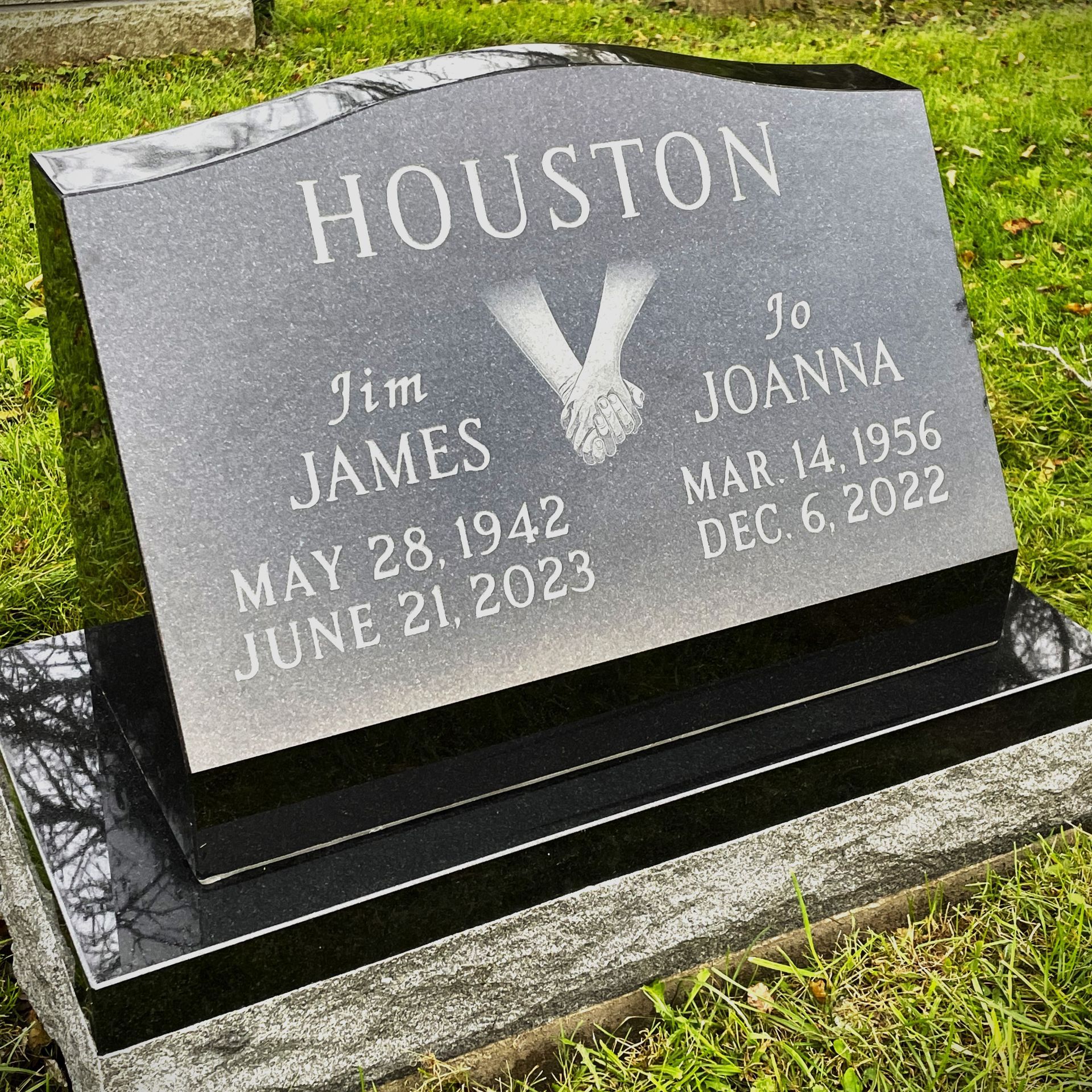 Black granite slant monument installed by Champlain Monuments